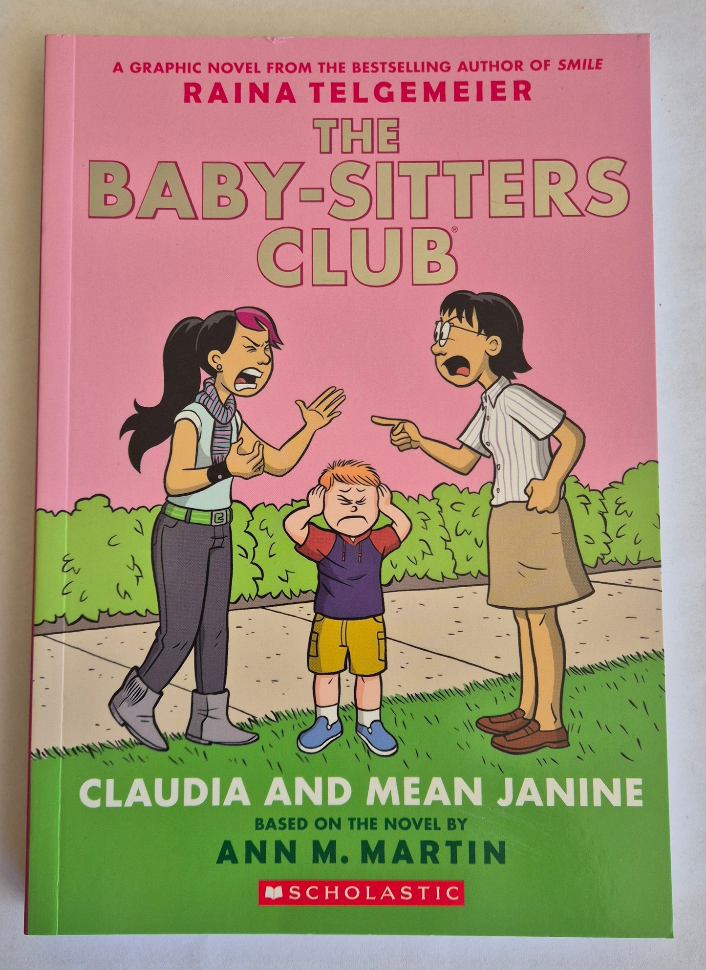 Claudia and Mean Janine (The Baby-Sitters Club Graphic Novels #4) by Raina Telgemeier
